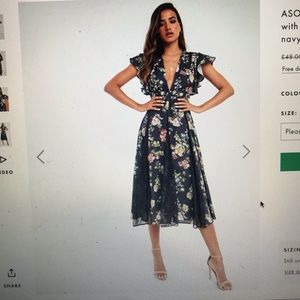 A midi navy floral dress with lace inserts